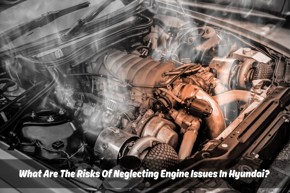 A close-up photo of a car engine compartment in disarray. Smoke is billowing out of the engine, and there are exposed wires and hoses. This image represents the potential consequences of neglecting engine issues in a Hyundai car.